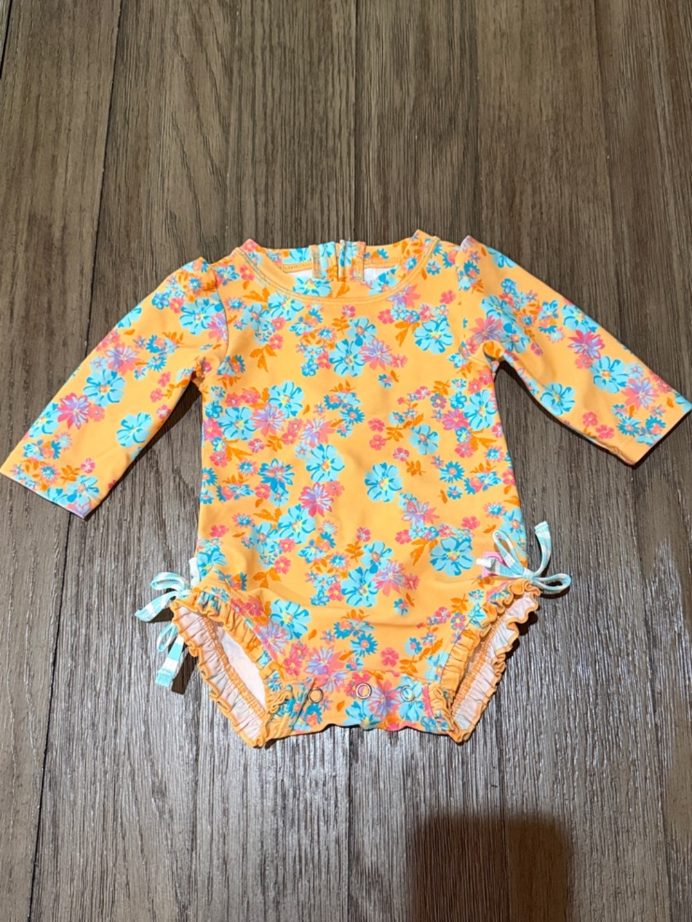 RuffleButts Baby Girl Floral Long Sleeve One-Piece Swimsuit - Orange 3-6 months